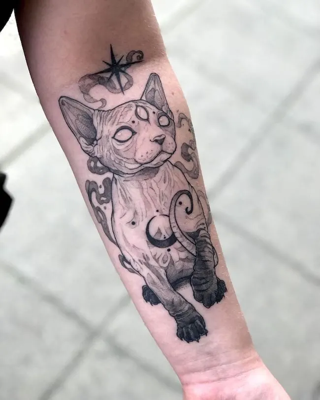 Intimidating witchy cat tattoo by @marymad_tattoo