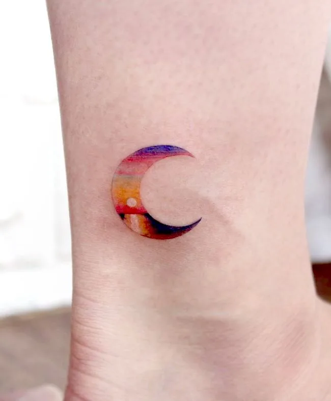 Sunset in the moon - a stunning landscape tattoo by @greem.tattoo