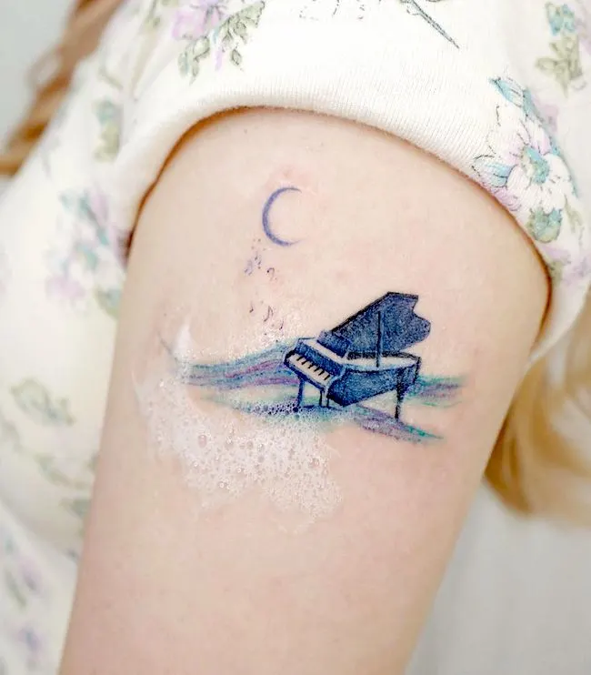 The serenade _ a beautiful watercolor tattoo by @ovenlee.tattoo