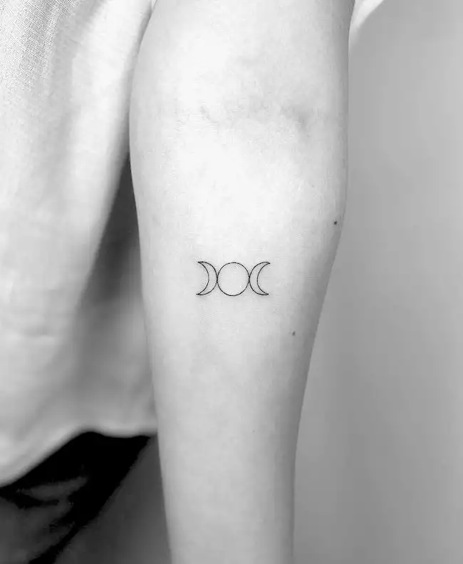 Triple moon symbol tattoo by @cagridurmaz
