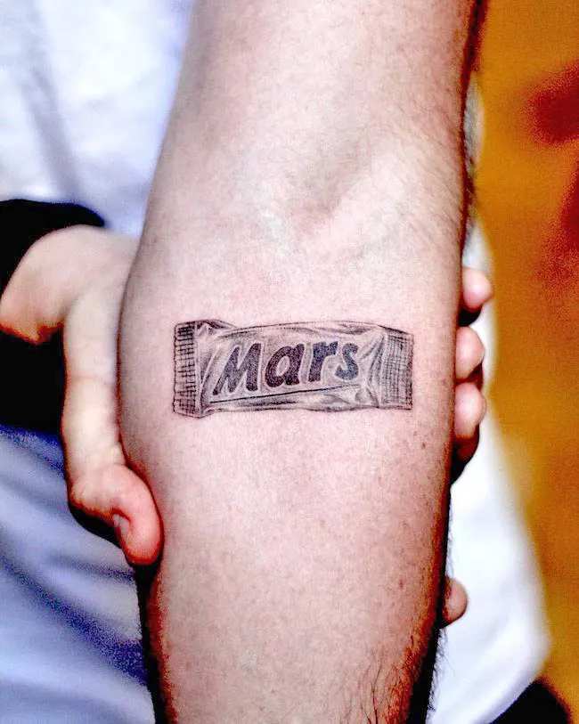 Chocolate bar inner arm tattoo by @eggsy_tattoo