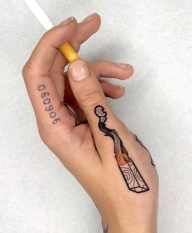 A badass cigarette finger tattoo by @vincent_bloodline