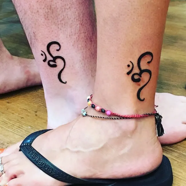 Matching abstract knot tattoos on the ankle by @allybabe78
