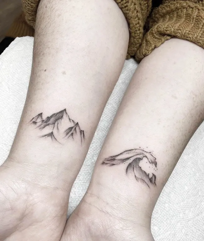 Mountain and waves - Matching mother and son tattoos by @baronart_amber