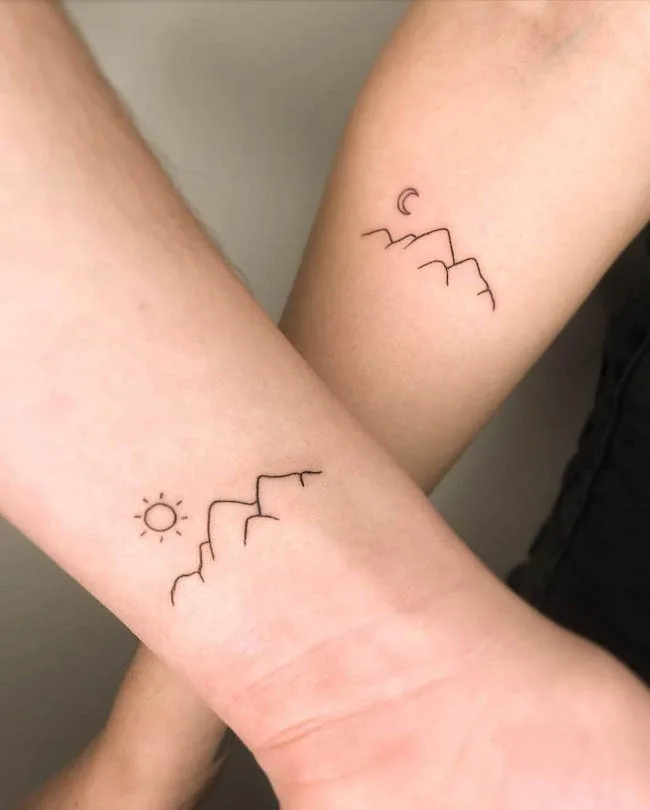 Day and night - Matching wrist tattoos for mother and son by @9dotstattoo