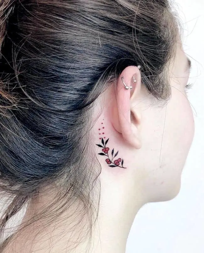 A feminine flower tattoo by @melikegunes.ink