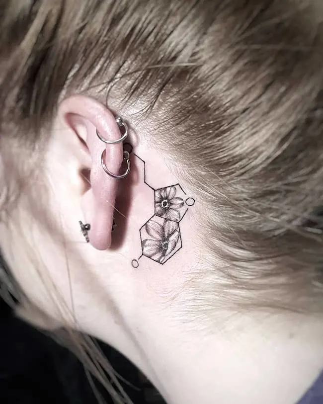 A floral molecule tattoo by @kathryne.pearl