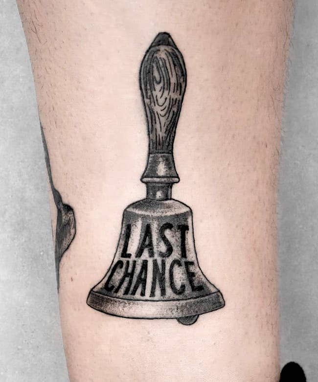 A mental health bell tattoo by @valentin.c.tattoos
