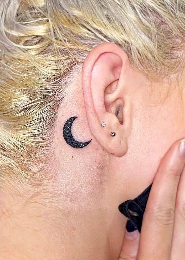 A mysterious black moon tattoo by @maddiemorrill_art