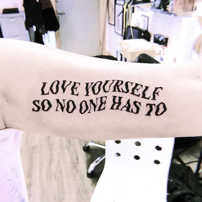 A sad love yourself tattoo by @demondance