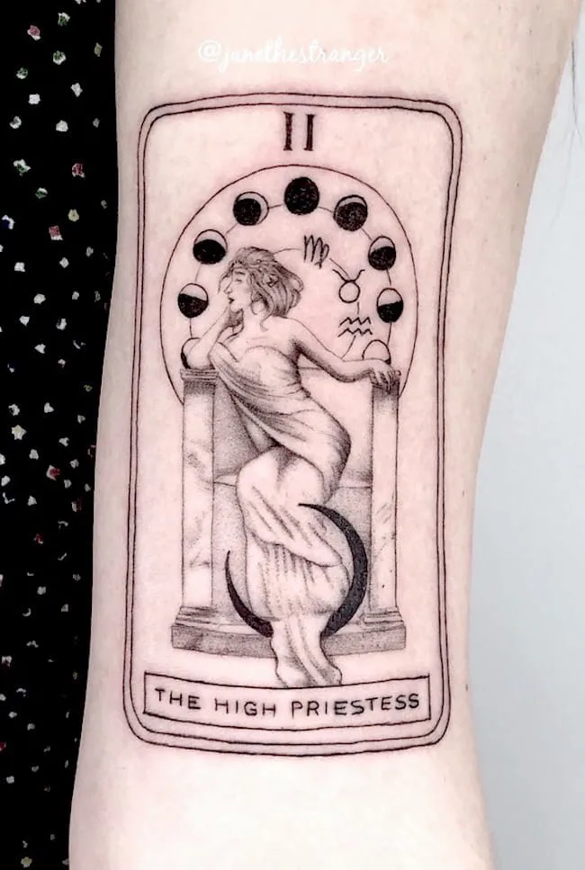A tarot tattoo with zodiac signs by @janethestranger