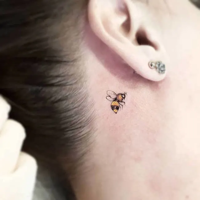 A tiny bee tattoo to hide or show by @karoldiastattooist