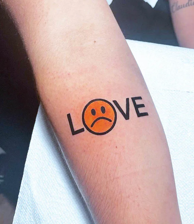Love is what makes you sad a one word tattoo by @flavio_filippi