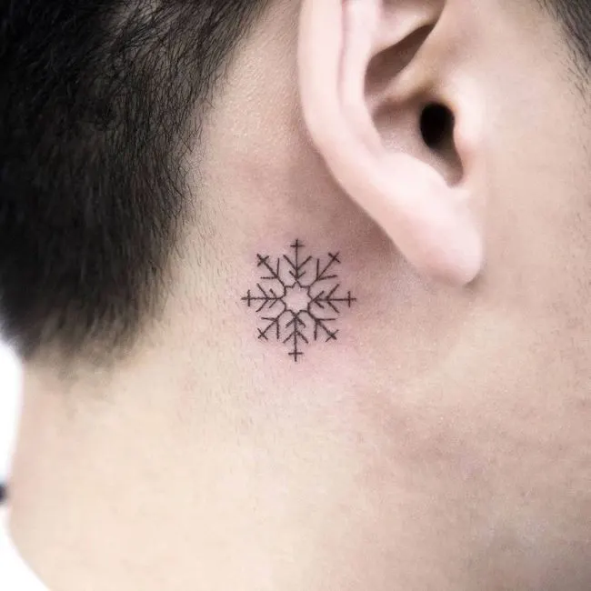 Snowflake tattoo behind the ear by @arona_tattoo