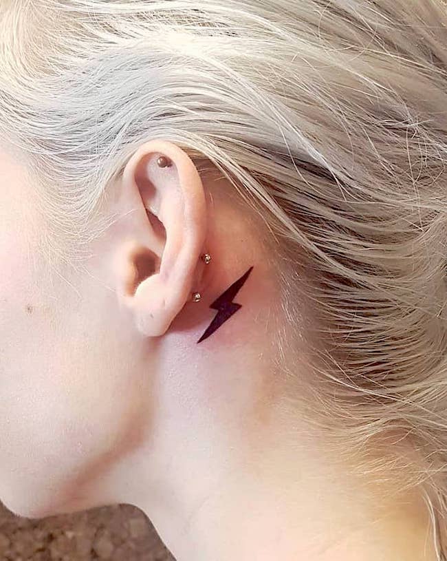 Lightning bolt tattoo behind ear meaning