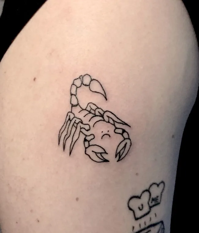 A moody Scorpio tattoo by @sasha.blvck_.ink