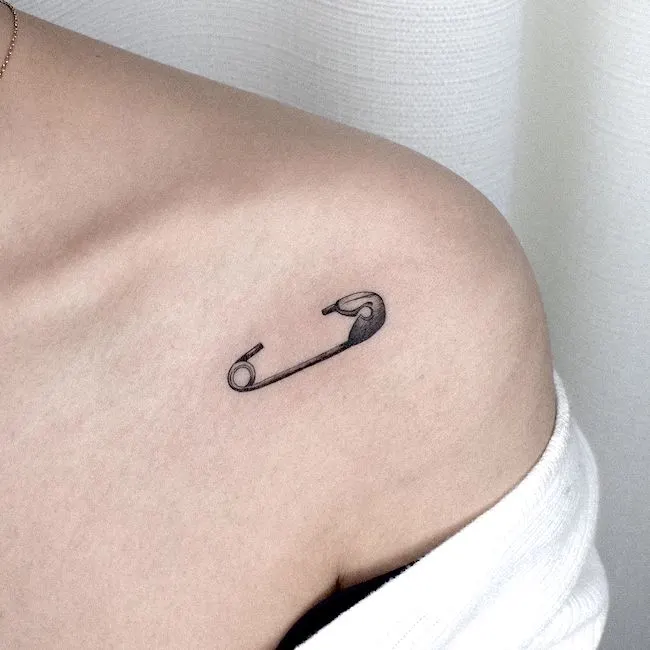 Safety pin tattoo tattoo on the shoulder by @gyu_tattoo- small meaningful tattoos
