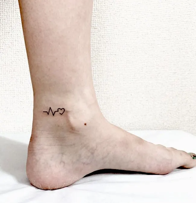 Heartbeat tattoo on the ankle by @pikaketattoo