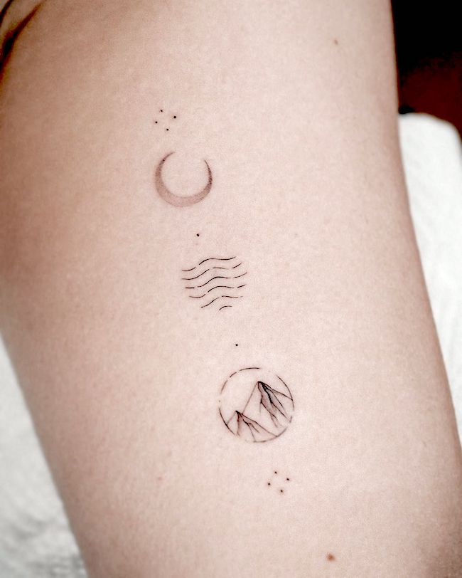 Moon sea and mountain symbol tattoo for travelers by @bunami.ink