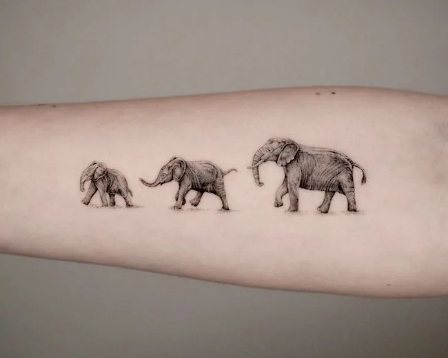 Mother and baby elephants tattoo by @philipppfohl