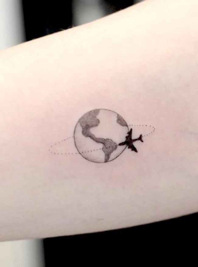 Travel around the world arm tattoo by @japassou_tattoo