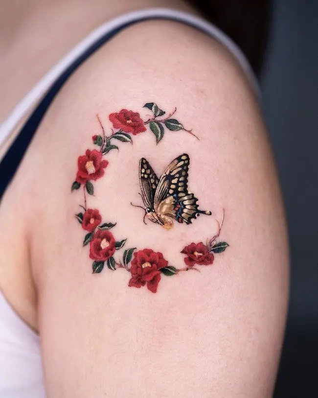 Butterfly and roses tattoo by @oozy_tattoo