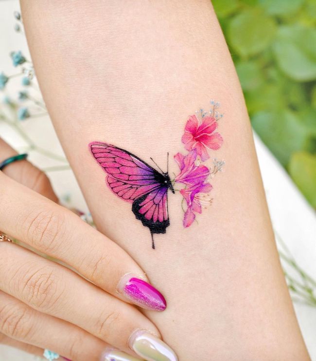 Floral butterfly tattoo by @songe.tattoo