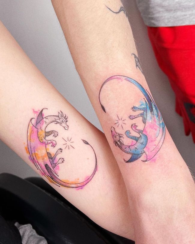 Matching watercolor dragon tattoos by @_tosz- best dragon tattoos for women and girls