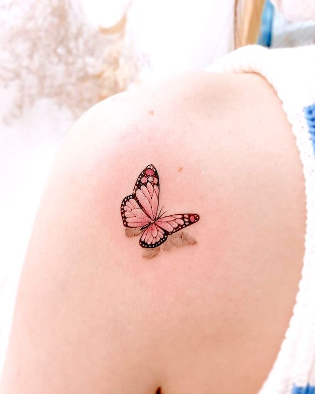 Realistic butterfly shoulder tattoo by @tattooist_j.l