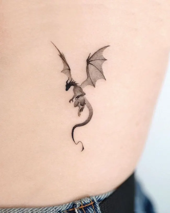 Happy dragon by Femme Fatale Tattoo  Tattoogridnet