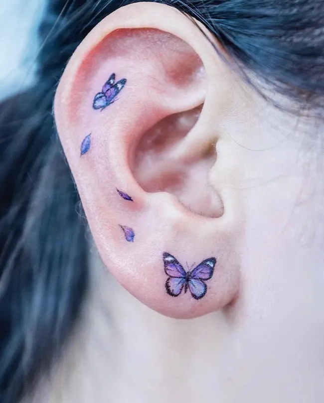 Minimalist Butterfly Tattoo Design Under EarButterfly Tattoo Ideas