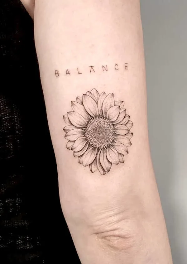 Balance - one-word tattoo with sunflower by @ju.linhas- Sunflower tattoos with meaning