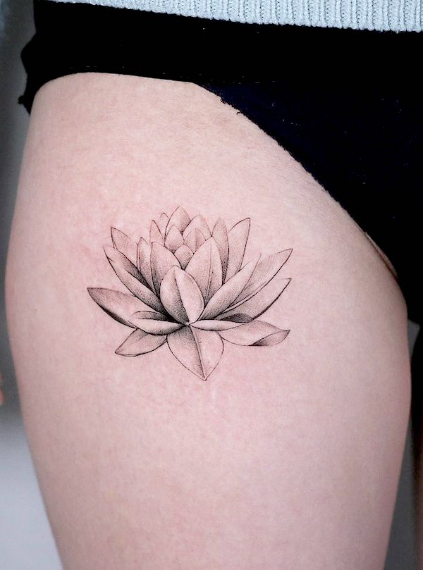 Black and white waterlily thigh tattoo by @honma_tat - Waterlily flower tattoos with meaning