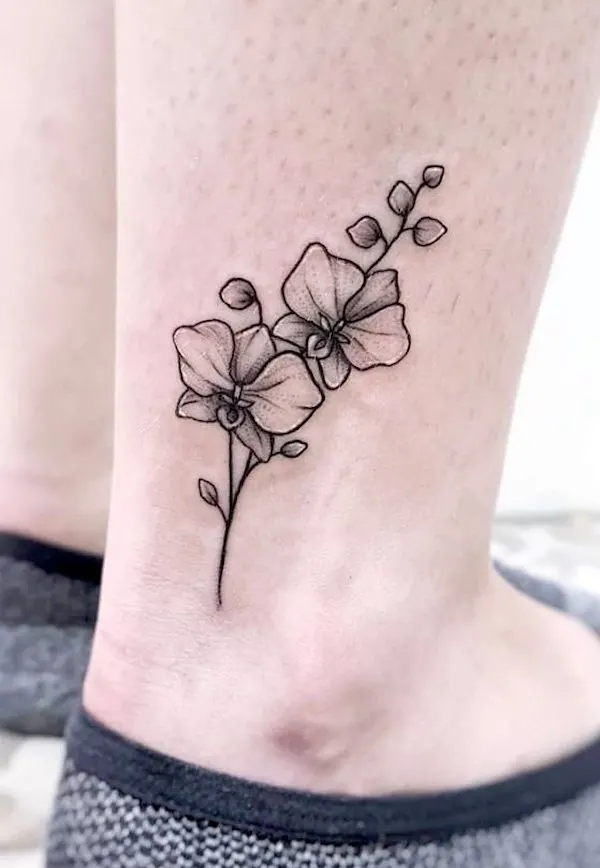 Black orchid ankle tattoo by @kim_dot_tattoo