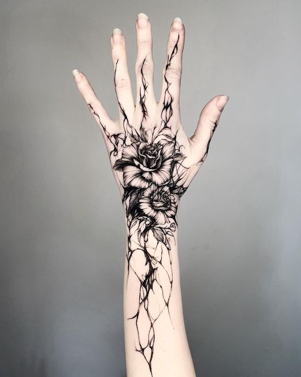 Black rose hand tattoo by @timor_tt - Rose tattoos with meaning