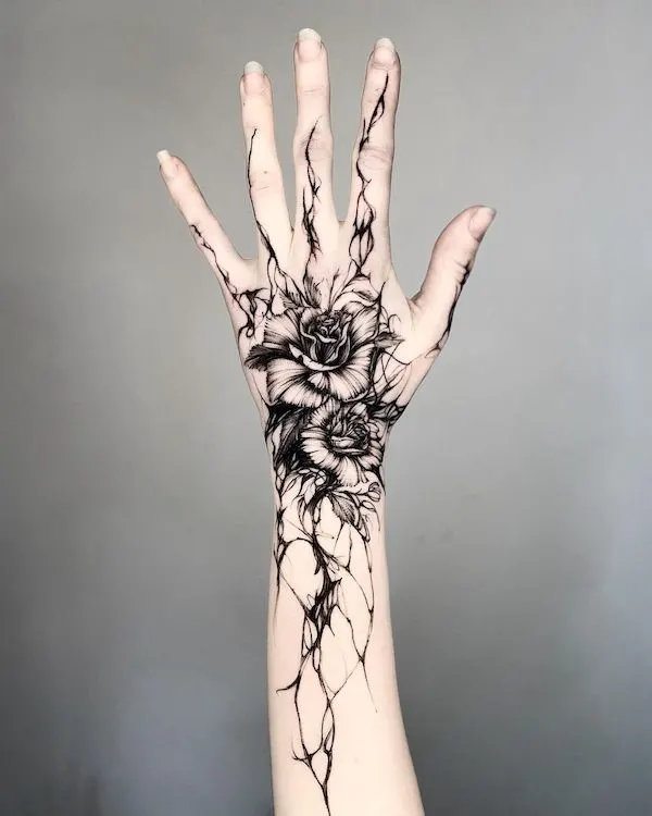 black rose tattoo hand