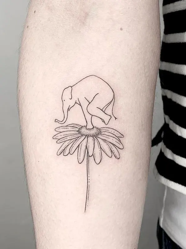 Daisy and elephant tattoo by @sara.commodi. - Daisy flower tattoos with meaning