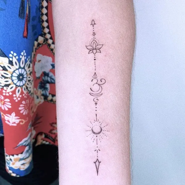 Lotus and symbols forearm tattoo by @juanitattt