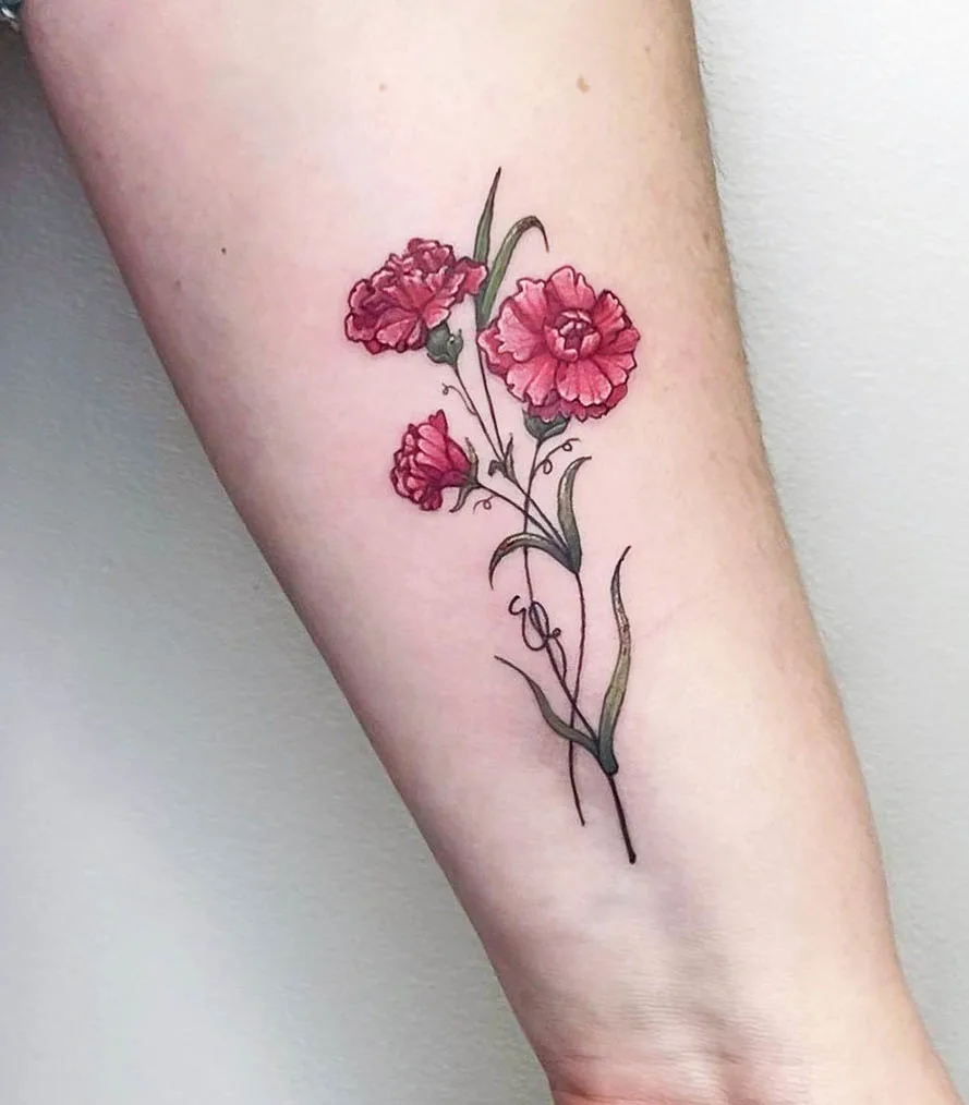 Red carnation wrist tattoo by @ma.ra.tattoo