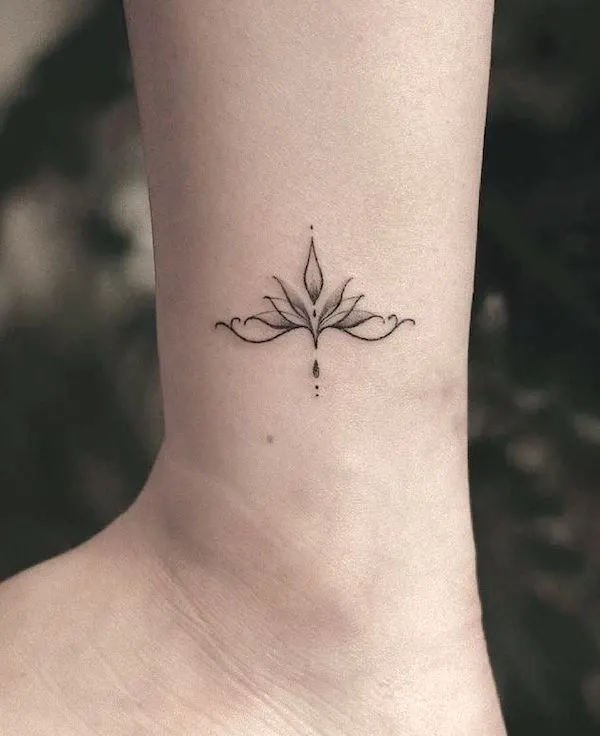 Small lotus symbol tattoo on the ankle by @sukza__art- Lotus flower tattoos with meaning