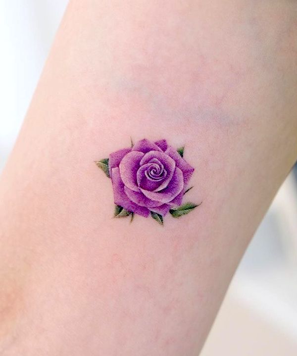 Small purple rose arm tattoo by @siyeon_tattoo