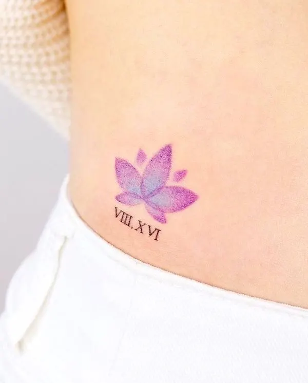 Tiny and simple purple lotus tattoo by @noul_tattoo- Lotus flower tattoos with meaning