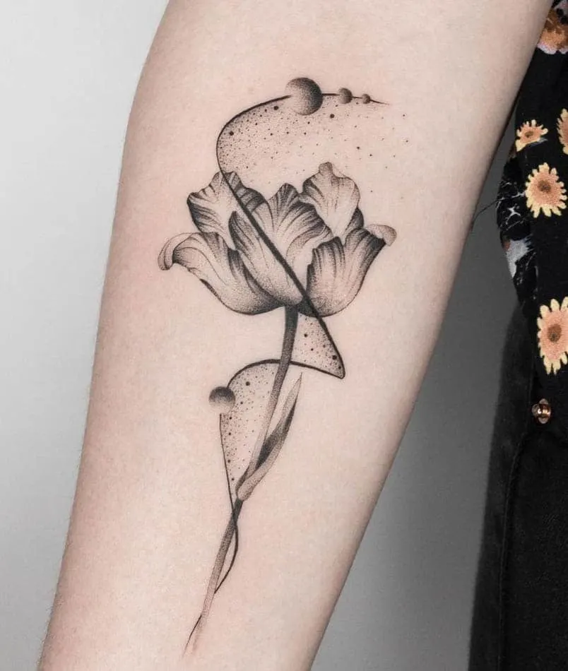 Tulip and Universe forearm tattoo by @klax.tattooer