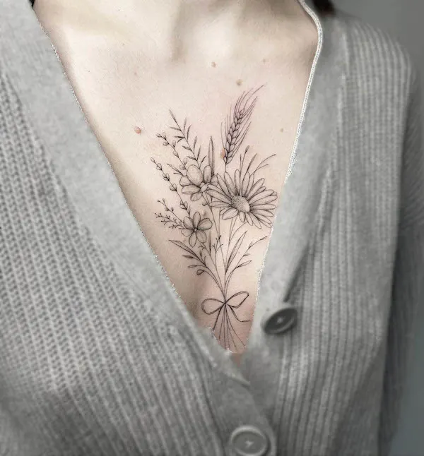 Wildflower chest tattoo by @fraulein.bunterkunt.tattoo