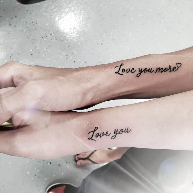 Love you more quote tattoo by @therootedlotustattooparlour