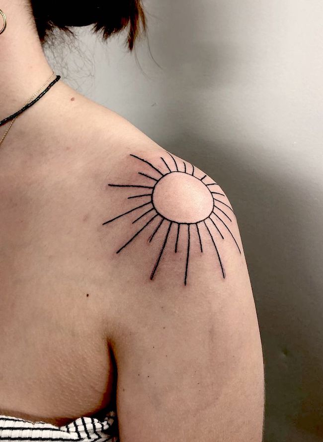 Minimalist sun shoulder tattoo by @raevage