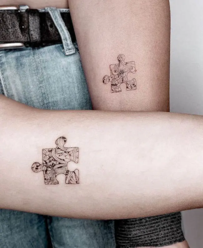 Puzzle pieces matching tattoos by @tattoostudiobecause