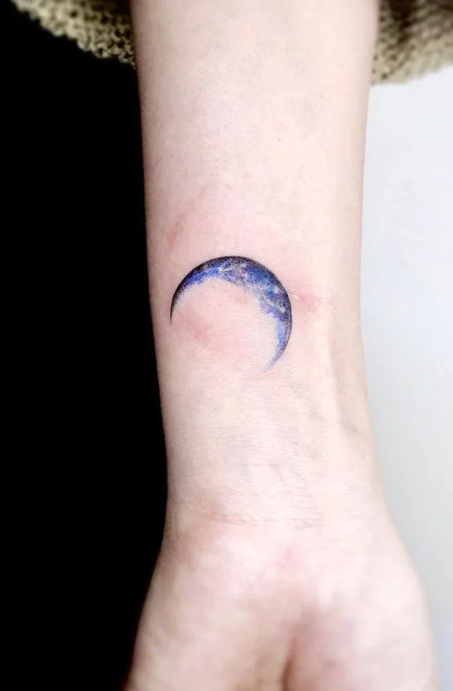 Watercolor blue crescent moon tattoo by @mint_tattooist