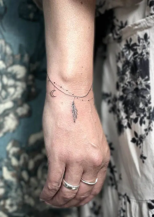 Beautiful bracelet tattoo for women by @sandra.hobe_nadelstiltattoo - Wrap around bracelet tattoo ideas