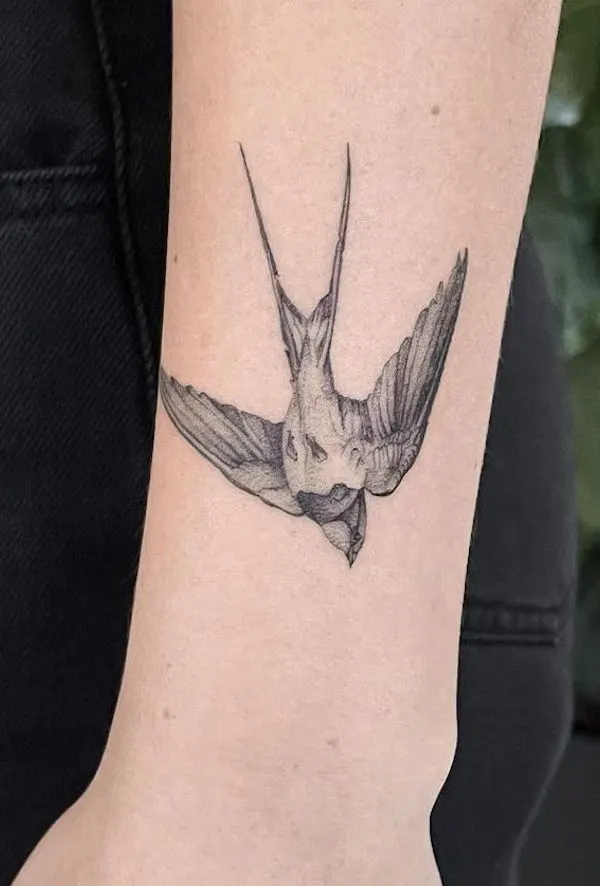 Black and grey bird tattoo on the wrist by @jayfineline